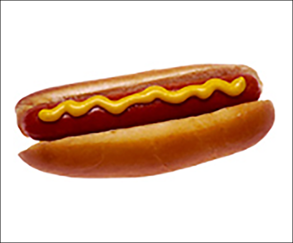 A single hot dog is centered against a white background. The hot dog consists of a cooked sausage nestled in a sliced bread bun. A generous squirt of bright yellow mustard runs in a zig-zag pattern along the top of the sausage. The bun is light brown and appears soft.